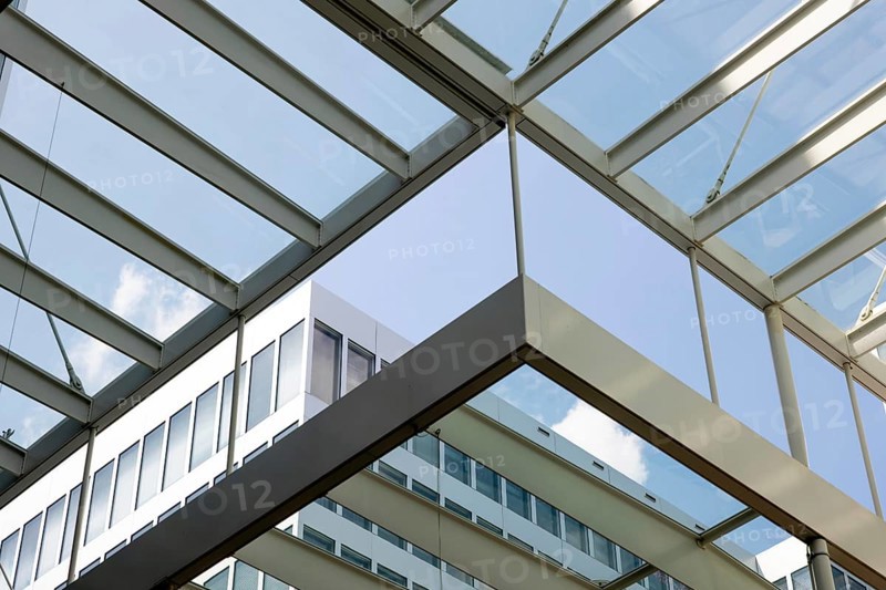 Modern Office Building in Zurich Airport in a Sunny Summer Day with Blue Sky and Clouds in the Airport in Kloten, Zurich, Zurich Canton, Switzerland