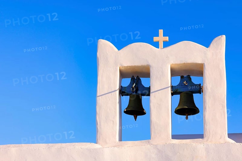Sunrise serenity over Sifnos Iconic bells tower, Sifnos, Cyclades Islands, Greece