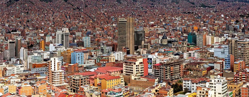 Dense urban development of La Paz with many buildings under a clear sky, The houses and skyscrapers of the city centre of La Paz in Bolivia