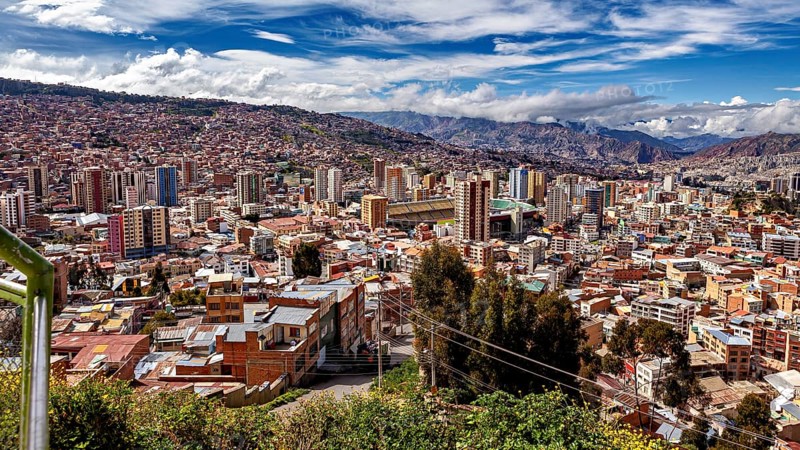 Hilly cityscape of La Paz with skyscrapers and clouds in the sky, The houses and skyscrapers of the city centre of La Paz in Bolivia