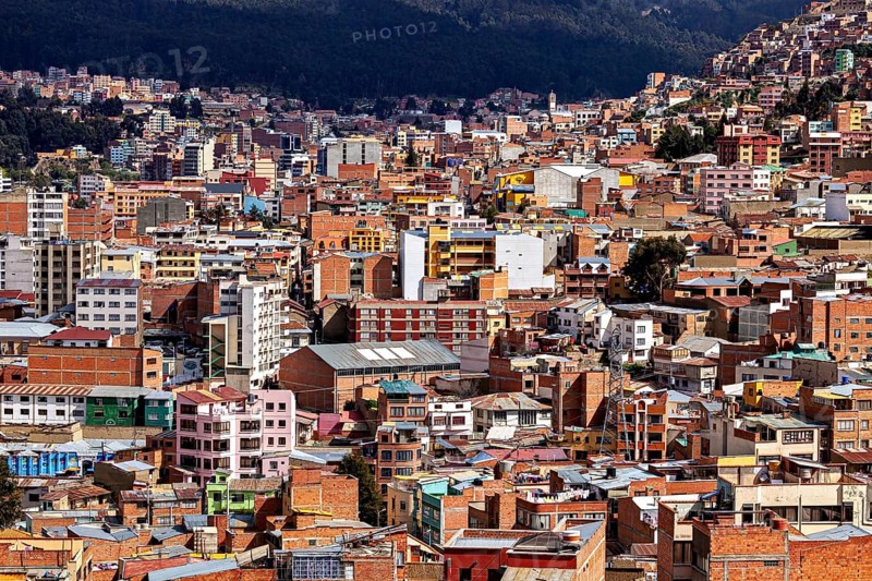 Dense urban development in front of a mountain landscape, The houses and skyscrapers of the city centre of La Paz in Bolivia