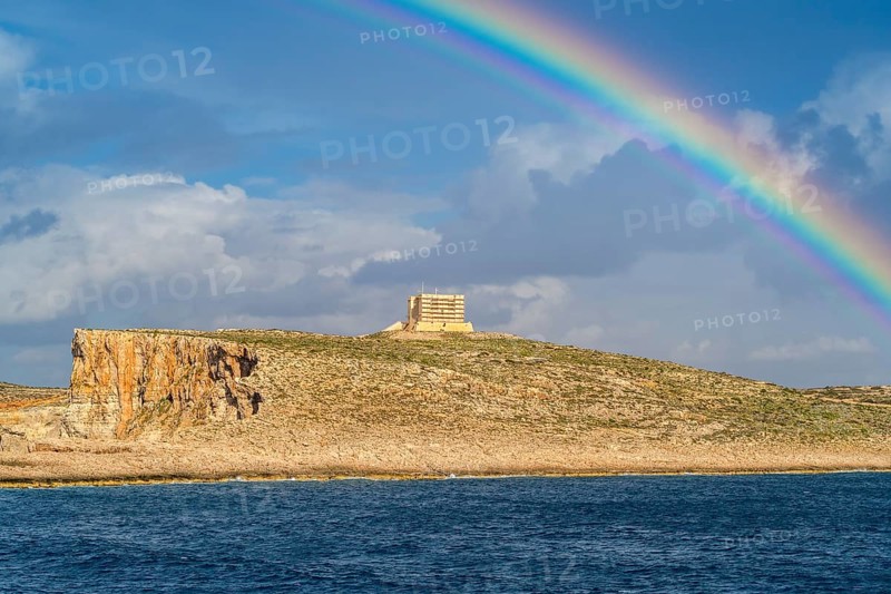 Amazing view of rainbow after the rain above Comino island, Malta