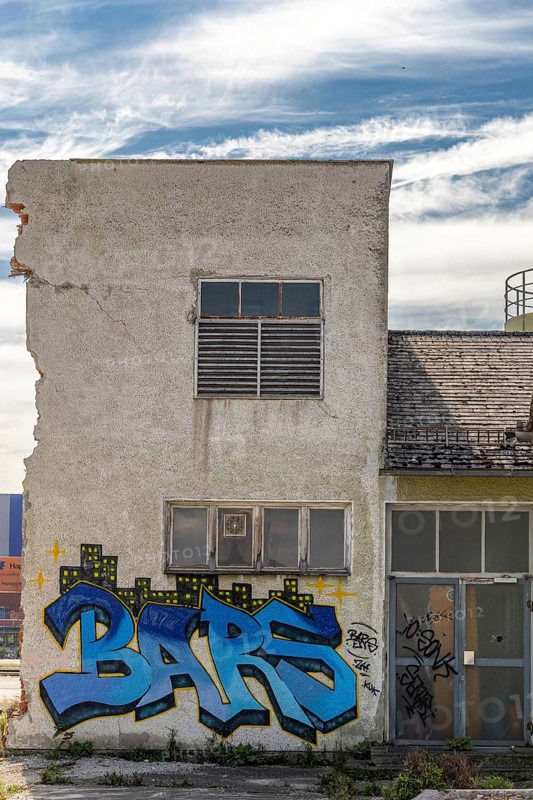 Graffiti with the word Bars on a dilapidated, urban building, at the harbour Linz Upper Austria Austria