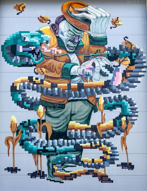 A man holding a hat, surrounded by pixelated snakes, at the harbour of Linz Upper Austria Austria