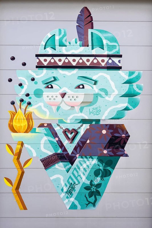 Illustration of a stylised cat decorated with a headdress and feather, at the port of Linz, Upper Austria Austria