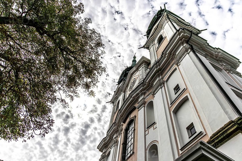 Impressive view of a baroque church from below with silhouette of trees, Pöstlingsbergkirche pilgrimage basilica Sieben Schmerzen Maria Linz Upper Austria Austria