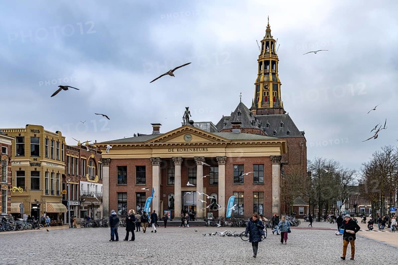 The Vismarkt fish market with the Korenbeurs former grain exchange and the steeple of the Aa church in Groningen, Netherlands