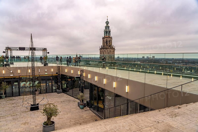 Roof terrace of the Forum Groningen and the Martinitoren church tower of the Martinikerk or Martini church in Groningen, Netherlands