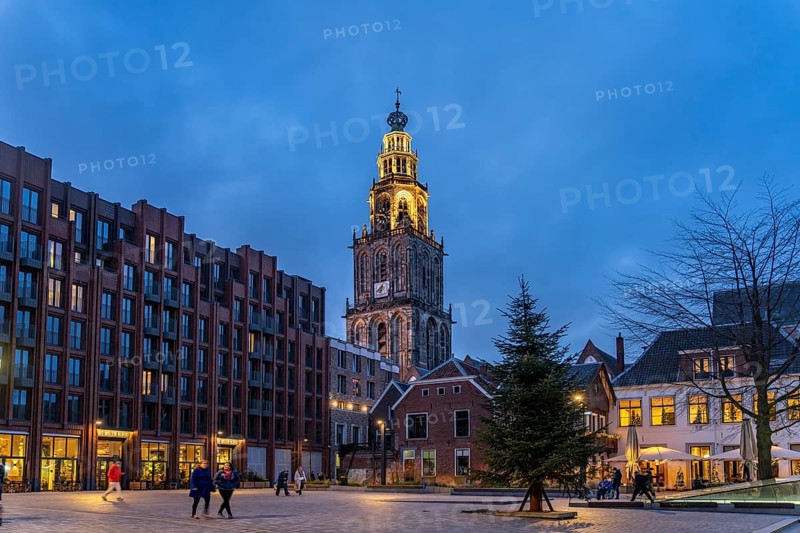 New Market and the Martinitoren church tower or Martinikerk church tower at dusk, Groningen, Netherlands