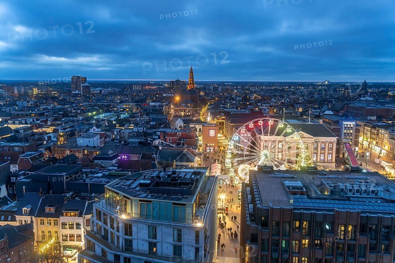 Groningen with the Ferris wheel on the Grote Markt seen from above at dusk, Netherlands