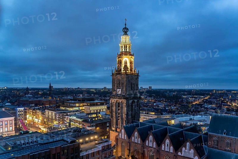 The church tower Martinitoren or Martinitower of the Martinikerk or Martinikirche seen from above at dusk, Groningen, Netherlands