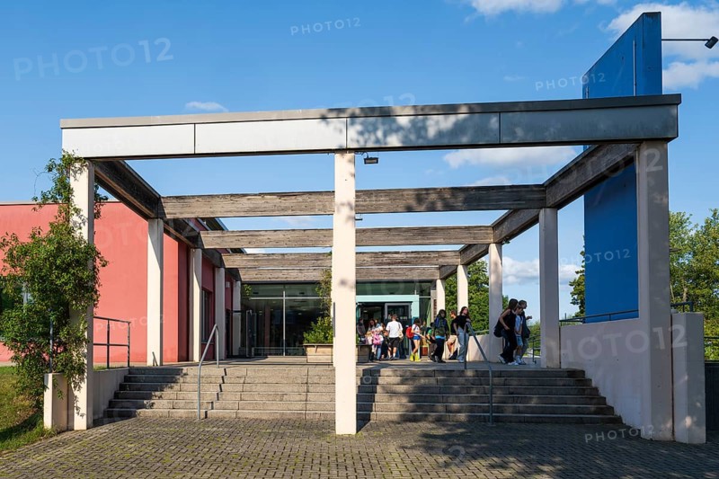Teenagers leaving the indoor swimming pool, Aqua Riese, Bad Staffelstein, Upper Franconia, Franconia, Bavaria, Germany