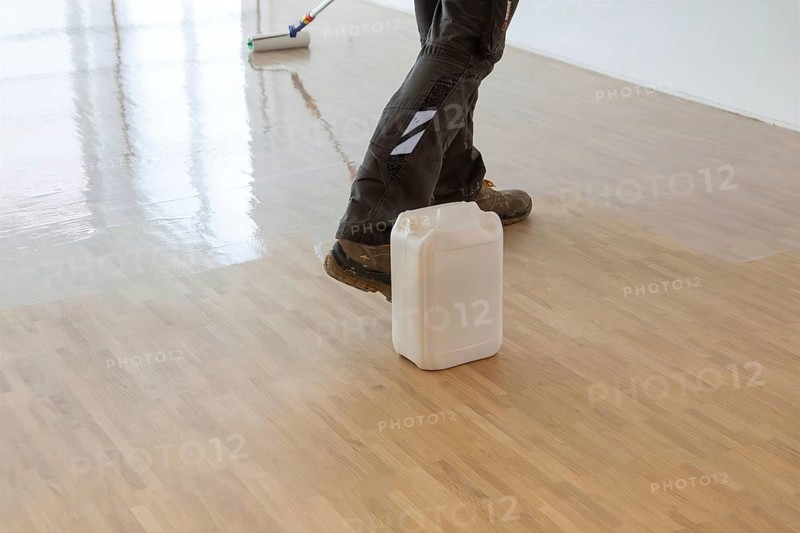 Professional sealing of a new parquet floor with lacquer