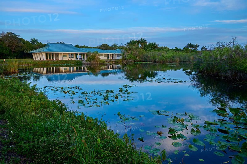 A house by a pond with water reflections and peaceful surroundings, Royal Palm Visitor Centre, Anhinga Trail, Everglades National Park, Florida, USA