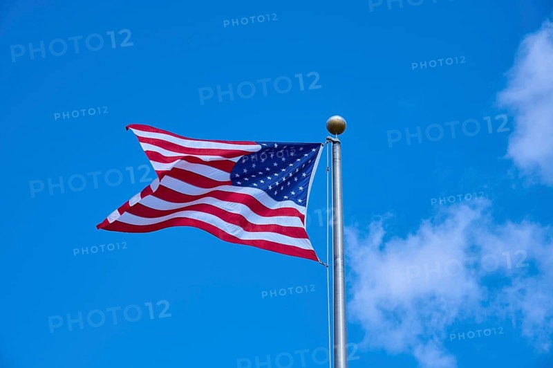 American flag fluttering against a clear blue sky on a sunny day, Flamingo, Everglades National Park, Florida, USA