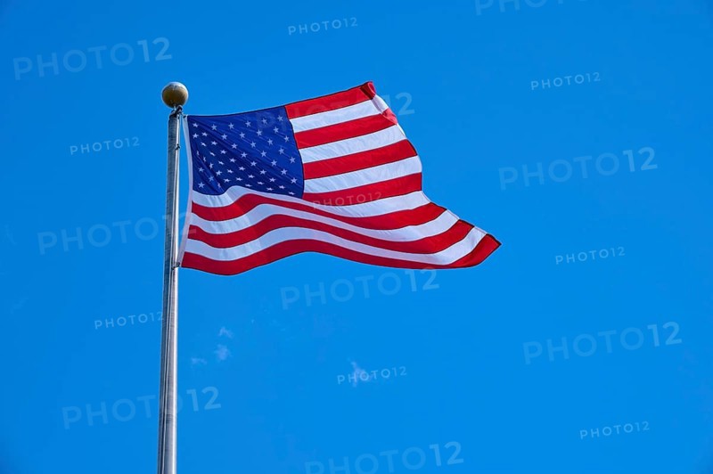 Stars and Stripes waving on a pole under a clear sky, Flamingo, Everglades National Park, Florida, USA
