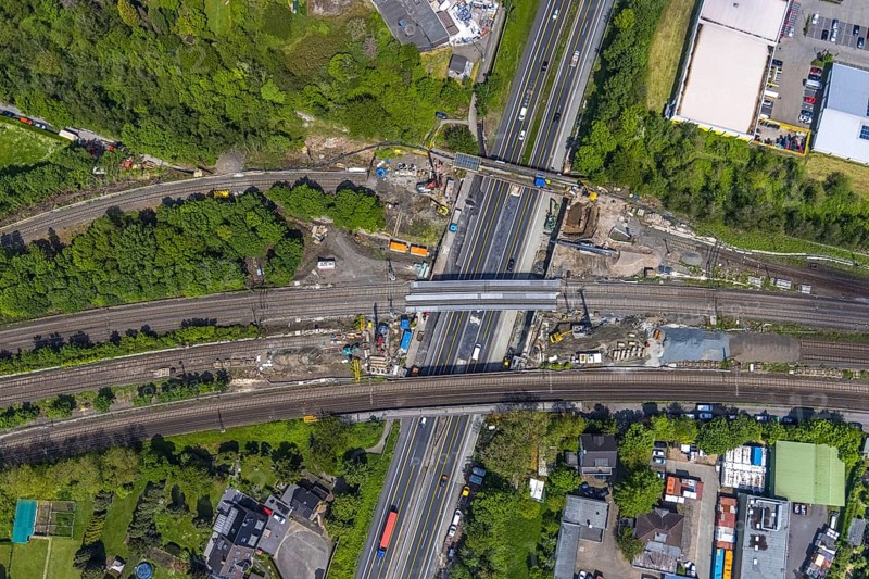 Aerial view, construction site after bridge fire motorway 40, renovation of railway bridges, Styrum, Mülheim an der Ruhr, Ruhr area, North Rhine-Westphalia, Germany, motorway A40, construction work, construction area, construction site, construction crane, construction measure, construction site, bridge, DE, railway bridge, renovation, Europe, aerial view, aerial photography, aerial photography, renovation, closure, tanker accident, overview, bird's eye view, bird's eye view, overview