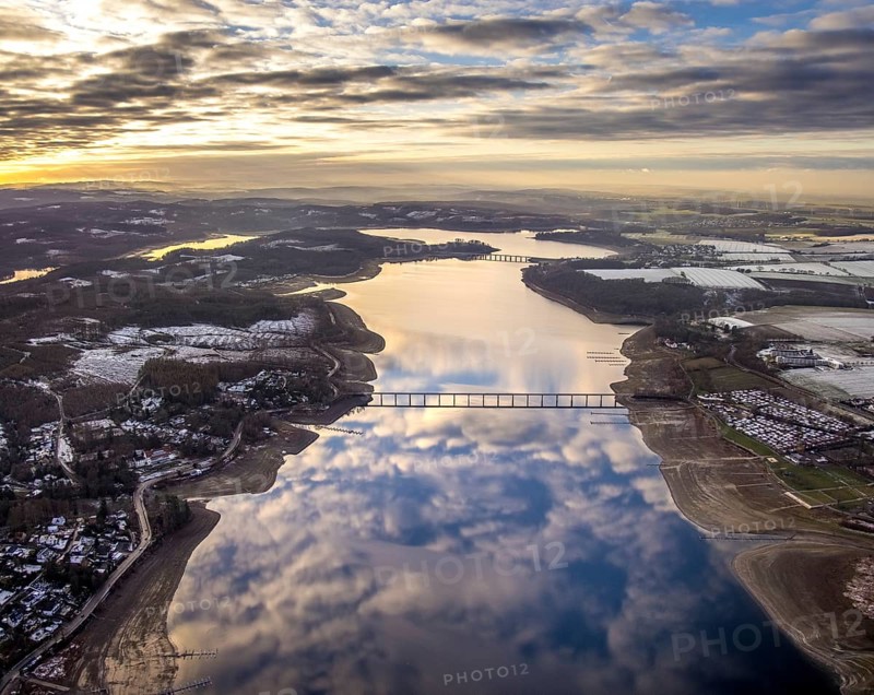 Aerial view of Lake Möhnesee in winter with snow and reflections of clouds on the water surface at low tide in Körbecke in Möhnesee in Sauerland in North Rhine-Westphalia, Germany, Möhnesee, Sauerland, North Rhine-Westphalia, DE, Europe, aerial photo, birds-eyes view, aerial photography, aerial photography, overview, bird's eye view