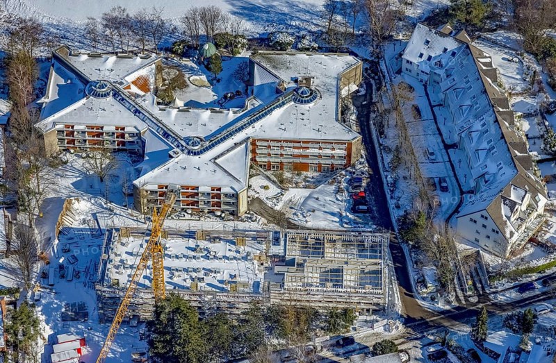 Aerial view, construction site and new building at Evang. Wohnstift Raadt, Holthausen - Südost, Mülheim an der Ruhr, Ruhr area, North Rhine-Westphalia, Germany, construction work, construction area, building site, building plots, construction project, building site, care and nursing, DE, Europe, aerial view, aerial photography, aerial photography, new building, nursing facility, nursing home, snow, retirement home, retirement centre, overview, bird's eye view, winter, residential home, assisted living, birds-eyes view, overview