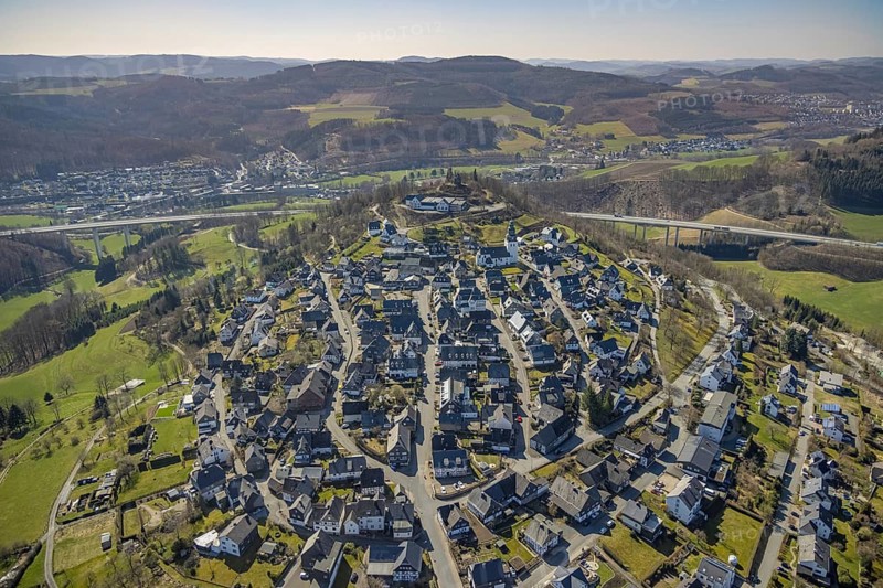 Aerial view, View of Eversberg, Ruins of Eversberg Castle, Schlossberghalle Eversberg, St.-Johannes-Evangelist-Kirche, Eversberg, Meschede, Sauerland, North Rhine-Westphalia, Germany, place of worship, castle, DE, Europe, religious community, place of worship, sacred site, church, parish, denomination, aerial view, aerial photography, aerial photography, religion, religious site, castle, castle hill, shooting hall, overview, bird's-eye view, birds-eyes view, overview