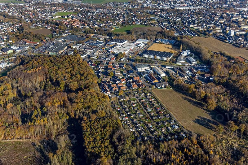 Aerial view, allotment garden site Menden Platte Heide and commercial area Holzener Straße in the district Holzen in Menden, Sauerland, North Rhine-Westphalia, Germany, DE, Europe, community garden, commercial enterprises, commercial area, commercial area, commercial park, commercial site, commercial use, industrial area, industrial site, allotment garden, allotment garden site, allotment garden association, allotment garden association, aerial view, aerial photography, aerial photography, Menden, allotment garden, overview, bird's-eye view, overview