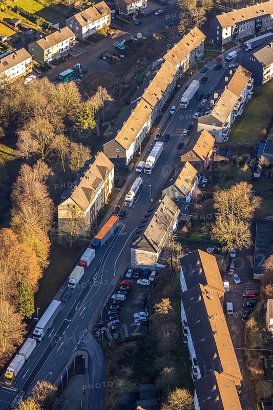 Aerial view, through road with truck traffic jam on the Lennestraße at the exit Lüdenscheid of the motorway A45 Sauerlandlinie because of the closed viaduct Rahmede in the district Leifringhausen in Lüdenscheid, Sauerland, North Rhine-Westphalia, Germany, A45, motorway junction, DE, Europe, truck traffic jam, aerial view, aerial photography, aerial photography, Lüdenscheid, through road, Sauerlandlinie, closure of the Rahmede viaduct, traffic jam, traffic jam, road traffic, overview, diversion, traffic volume, traffic chaos, traffic infrastructure, traffic jam, bird's eye view, birds-eyes view, dilapidated bridge, dilapidated bridges, overview