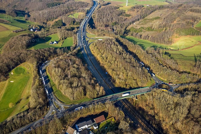 Aerial view, truck traffic jam on the Sterbecke viaduct at the Lüdenscheid-Nord exit in front of the closed Rahmede viaduct of the A45 Sauerlandlinie motorway in the Heedfeld district of Schalksmühle, Sauerland, North Rhine-Westphalia, Germany, A45, DE, Europe, truck traffic jam, aerial view, aerial photography, aerial photography, local traffic, Sauerlandlinie, Schalksmühle, damage to the steel structure, closure of the Rahmede viaduct, traffic jam, traffic jams, overview, traffic volume, traffic chaos, traffic infrastructure, traffic jam, bird's-eye view, birds-eyes view, lack of load-bearing capacity, closed Rahmede viaduct, dilapidated bridge, dilapidated bridges, overview
