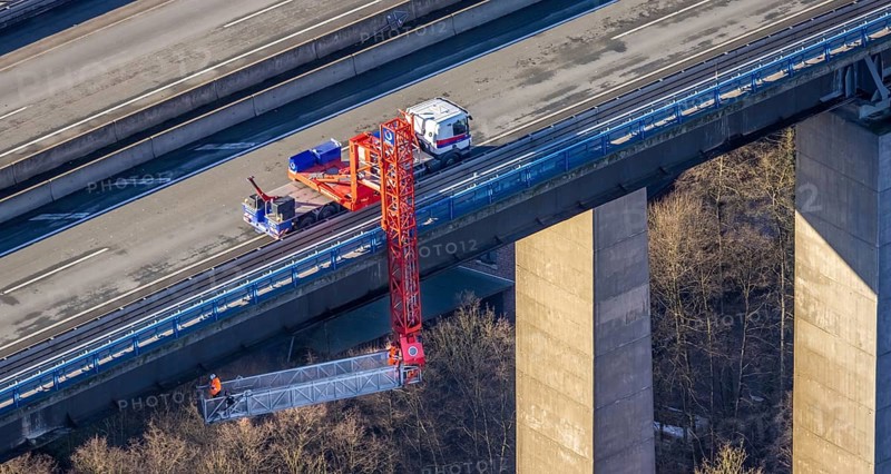 Aerial photo, construction measure with emergency reinforcement for Rahmede viaduct on the A45 Sauerlandlinie motorway in the Gevelndorf district of Lüdenscheid, Sauerland, North Rhine-Westphalia, Germany, A45, construction work, construction measure, construction site, DE, Europe, aerial photo, aerial photography, aerial photography, Lüdenscheid, emergency reinforcement, through road, Rahmede viaduct, Sauerland line, closure of Rahmede viaduct, traffic jam, traffic jam, overview, traffic chaos, traffic infrastructure, traffic jam, bird's-eye view, lack of load-bearing capacity, dilapidated bridge, dilapidated bridges, overview