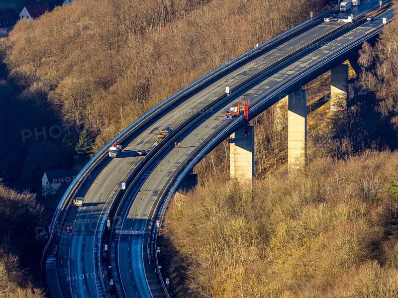 Aerial photograph, construction work with emergency reinforcement on the dilapidated and closed Rahmede viaduct of the A45 Sauerlandlinie motorway over Altenaer Straße in the Gevelndorf district of Lüdenscheid, Sauerland, North Rhine-Westphalia, Germany, A45, construction work, construction measure, construction site, DE, Europe, aerial photograph, aerial photography, aerial photography, Lüdenscheid, emergency reinforcement, through road, Rahmede valley bridge, Sauerland line, closure of the Rahmede valley bridge, traffic jam, traffic jams, overview, traffic chaos, traffic infrastructure, traffic jam, bird's eye view, forest area, birds-eyes view, lack of load-bearing capacity, dilapidated bridge, dilapidated bridges, overview