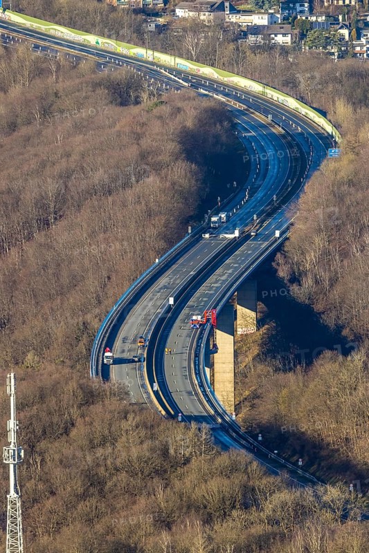 Aerial photograph, construction work with emergency reinforcement on the dilapidated and closed Rahmede viaduct of the A45 Sauerlandlinie motorway over Altenaer Straße in the Gevelndorf district of Lüdenscheid, Sauerland, North Rhine-Westphalia, Germany, A45, construction work, construction measure, construction site, DE, Europe, aerial photograph, aerial photography, aerial photography, Lüdenscheid, emergency reinforcement, through road, Rahmede valley bridge, Sauerland line, closure of the Rahmede valley bridge, traffic jam, traffic jams, overview, traffic chaos, traffic infrastructure, traffic jam, bird's eye view, forest area, birds-eyes view, lack of load-bearing capacity, dilapidated bridge, dilapidated bridges, overview
