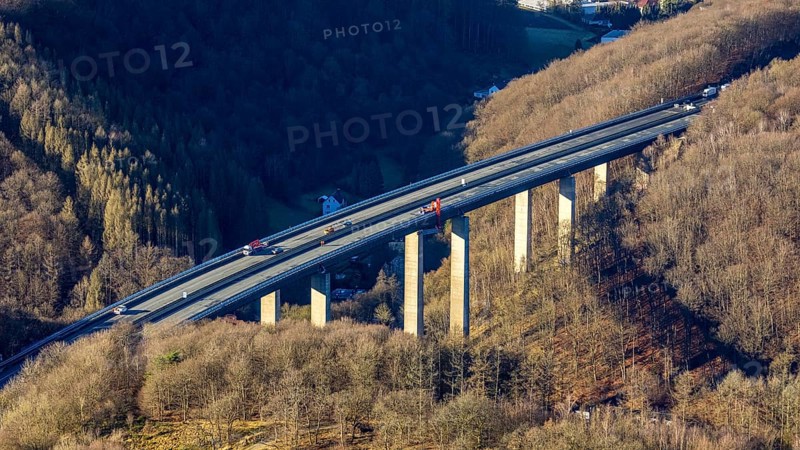 Aerial photograph, construction work with emergency reinforcement on the dilapidated and closed Rahmede viaduct of the A45 Sauerlandlinie motorway over Altenaer Straße in the Gevelndorf district of Lüdenscheid, Sauerland, North Rhine-Westphalia, Germany, A45, construction work, construction measure, construction site, DE, Europe, aerial photograph, aerial photography, aerial photography, Lüdenscheid, emergency reinforcement, through road, Rahmede valley bridge, Sauerland line, closure of the Rahmede valley bridge, traffic jam, traffic jams, overview, traffic chaos, traffic infrastructure, traffic jam, bird's eye view, forest area, birds-eyes view, lack of load-bearing capacity, dilapidated bridge, dilapidated bridges, overview