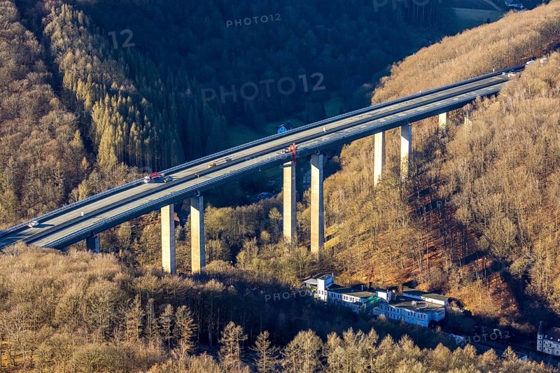 Aerial photograph, construction work with emergency reinforcement on the dilapidated and closed Rahmede viaduct of the A45 Sauerlandlinie motorway over Altenaer Straße in the Gevelndorf district of Lüdenscheid, Sauerland, North Rhine-Westphalia, Germany, A45, construction work, construction measure, construction site, DE, Europe, aerial photograph, aerial photography, aerial photography, Lüdenscheid, emergency reinforcement, through road, Rahmede valley bridge, Sauerland line, closure of the Rahmede valley bridge, traffic jam, traffic jams, overview, traffic chaos, traffic infrastructure, traffic jam, bird's eye view, forest area, birds-eyes view, lack of load-bearing capacity, dilapidated bridge, dilapidated bridges, overview