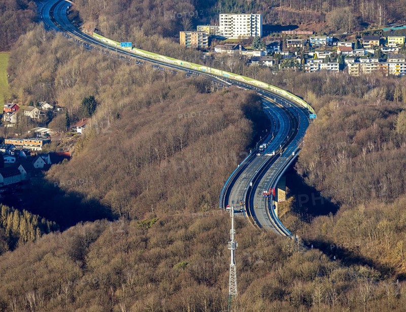 Aerial photograph, construction work with emergency reinforcement on the dilapidated and closed Rahmede viaduct of the A45 Sauerlandlinie motorway over Altenaer Straße in the Gevelndorf district of Lüdenscheid, Sauerland, North Rhine-Westphalia, Germany, A45, construction work, construction measure, construction site, DE, Europe, aerial photograph, aerial photography, aerial photography, Lüdenscheid, emergency reinforcement, through road, Rahmede valley bridge, Sauerland line, closure of the Rahmede valley bridge, traffic jam, traffic jams, overview, traffic chaos, traffic infrastructure, traffic jam, bird's eye view, forest area, birds-eyes view, lack of load-bearing capacity, dilapidated bridge, dilapidated bridges, overview