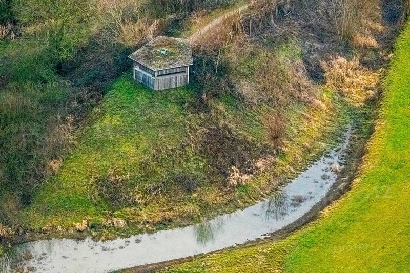 Aerial view of the national nature reserve Lippeauen at the river Lippe with the observation hut Disselmersch near Heintrop in Lippetal in North Rhine-Westphalia, Germany. Geese fly over the river Lippe, Lippetal, Ruhr area, North Rhine-Westphalia, Germany, DE, Europe, aerial photograph, birds-eyes view, aerial photography, aerial photography, overview, bird's eye view