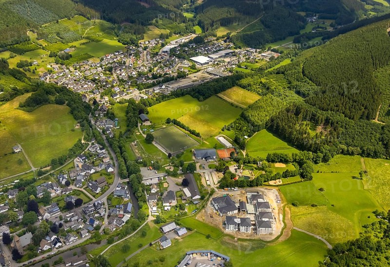 Aerial view, new senior-friendly residential complex WohnGut, spa and community centre, natural adventure pool Lennestadt- Saalhausen, Marien-Grundschule, Saalhausen, Lennestadt, Sauerland, North Rhine-Westphalia, Germany, retirement home, old people's home, construction work, construction area, building site, building plots, construction project, construction site, care and nursing, education, educational institution, DEU, Europe, Fasanenweg, leisure facility, primary school, spa hotel, teaching institute, aerial view, aerial photography, aerial photography, new building, care facility, school, retirement home, retirement residence, retirement home, retirement centre, overview, bird's-eye view, bird's-eye view, overview