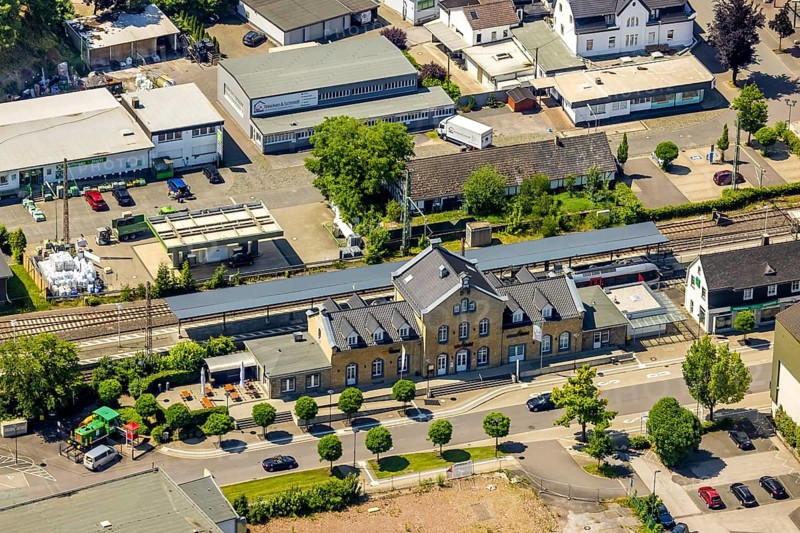 Aerial view, Lennestadt-Grevenbrück railway station, EssBahnhof and KulturBahnhof, Lennestadt, Sauerland, North Rhine-Westphalia, Germany, railway station, station forecourt, DEU, Deutsche Bahn AG, Europe, gastronomy, central station, main station, culture, art, aerial view, aerial photography, aerial photography, aerial photography, restaurant, overview, event location, bird's-eye view, birds-eyes view, cultural use, overview