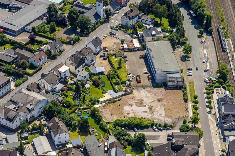 Aerial view, Lennestadt-Grevenbrück railway station, wasteland at the forecourt, Lennestadt, Sauerland, North Rhine-Westphalia, Germany, railway station, station forecourt, building site, building plots, DEU, Deutsche Bahn AG, Europe, gastronomy, main station, main railway station, culture, art, aerial view, aerial photography, aerial photography, restaurant, overview, event location, bird's-eye view, birds-eyes view, cultural use, overview