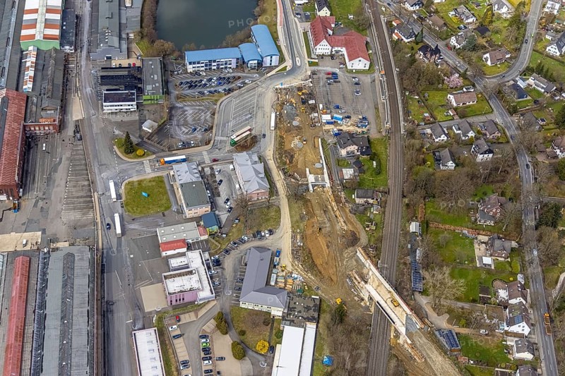 Aerial view, construction site and replacement construction of the DB bridge and new road construction B517, Eichen district, Kreuztal, Sauerland, North Rhine-Westphalia, Germany, construction work, construction site, building site, building plots, construction project, construction site, bridge, DE, Europe, Hagener Straße, Siegen-Wittgenstein district, aerial photograph, aerial photography, aerial photography, new construction, overview, bird's-eye view, overview, thyssenkrupp Stahlkontor Zweigniederlassung der thyssenkrupp Schulte GmbH