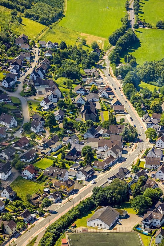 Aerial view, view of Oberelspe, federal road 55 and catholic church St. Maria Immaculata, Lennestadt, Sauerland, North Rhine-Westphalia, Germany, place of worship, mountains and valleys, DEU, Europe, football pitch, religious community, place of worship, property tax, holy place, real estate, church, parish, denomination, aerial view, aerial photography, aerial photography, religion, religious site, sports, sports facilities, sports field, sports facility, overview, bird's-eye view, forest, forest area, residential area, housing and living, residential area, residential buildings, quality of living, birds-eyes view, overview