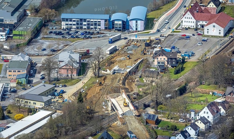 Aerial view, construction site and replacement construction of the DB bridge and new road construction B517, Eichen district, Kreuztal, Sauerland, North Rhine-Westphalia, Germany, construction work, construction site, building site, building plots, construction project, construction site, bridge, DE, Europe, Hagener Straße, Siegen-Wittgenstein district, aerial photograph, aerial photography, aerial photography, new construction, overview, bird's-eye view, overview, thyssenkrupp Stahlkontor Zweigniederlassung der thyssenkrupp Schulte GmbH