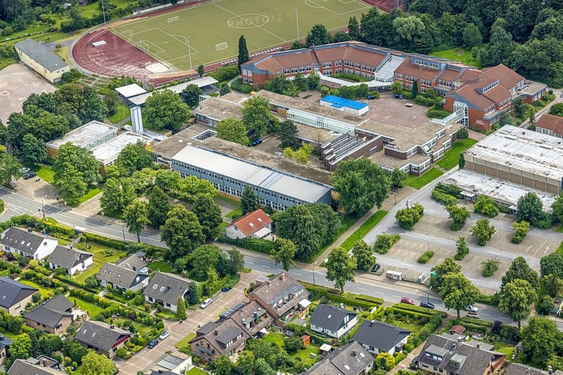 Aerial view, sports field school centre, Clara-Schumann-Gymnasium with solar roof, Josef Reding Schule, Freiberg, Holzwickede, Ruhr area, North Rhine-Westphalia, Germany, education, educational institution, DE, Europe, football pitch, football stadium, grammar school, teaching institute, athletics stadium, aerial view, aerial photography, aerial photography, school, sport, sports facilities, sports field, sports facility, stadium, overview, bird's-eye view, bird's-eye view, overview