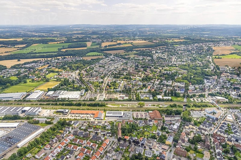 Aerial view, Holzwickede railway station, local supply centre, new Aldi supermarket, Freiberg, Holzwickede, Ruhr area, North Rhine-Westphalia, Germany, new Aldi supermarket, railway tracks, railway station, DE, Deutsche Bahn AG, shopping markets, shopping square, shopping centre, Europe, main station, main railway station, aerial view, aerial photography, aerial photography, photovoltaics, photovoltaic system, solar, solar system, solar roof, solar energy, solar energy, supermarket, overview, bird's eye view, birds-eyes view, overview