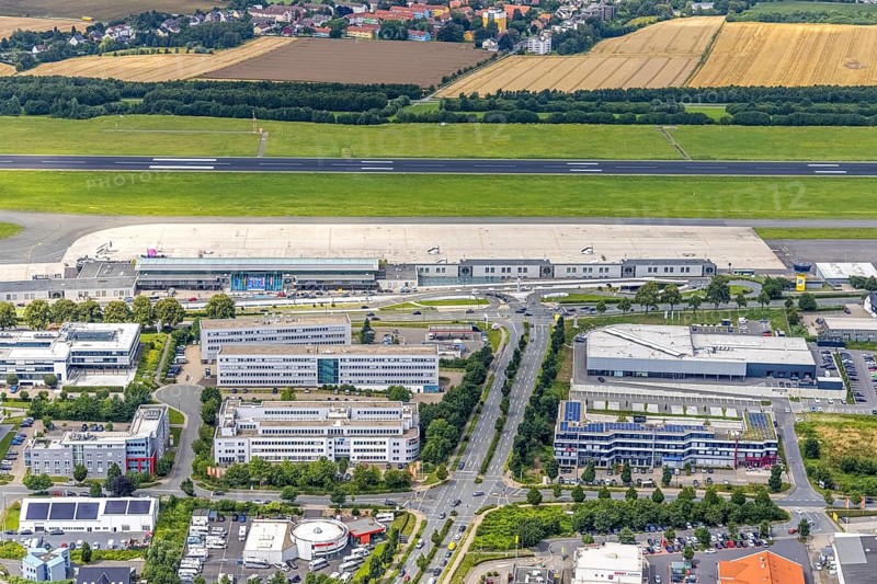 Aerial photograph, Dortmund Airport with new Porsche Centre, Natorp, Holzwickede, Ruhr area, North Rhine-Westphalia, Germany, terminal building, DE, reception building, Europe, flight emission, airport, aircraft noise, airfield, aerial photograph, aerial photography, aerial photography, overview, bird's-eye view, overview