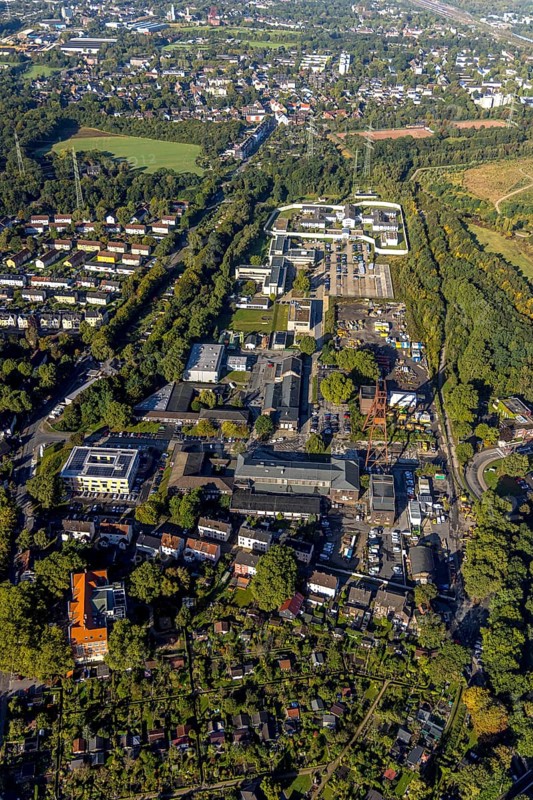 Aerial view, Wilhelmstraße industrial estate with winding tower of the former Pluto colliery and Herne prison in the Wanne district of Herne, Ruhr area, North Rhine-Westphalia, Germany, DE, Europe, imprisonment, detention, detention centre, Herne, correctional facility, aerial photograph, aerial photography, aerial photography, overview, custody, bird's-eye view, colliery site, birds-eyes view, overview