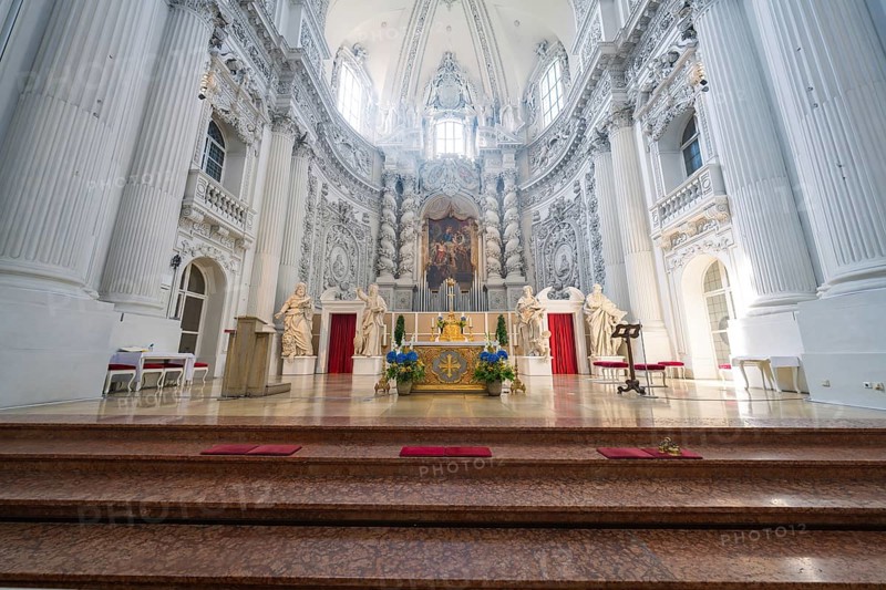 Magnificent baroque church interior with an ornate altar and lavish details, Munich, Germany