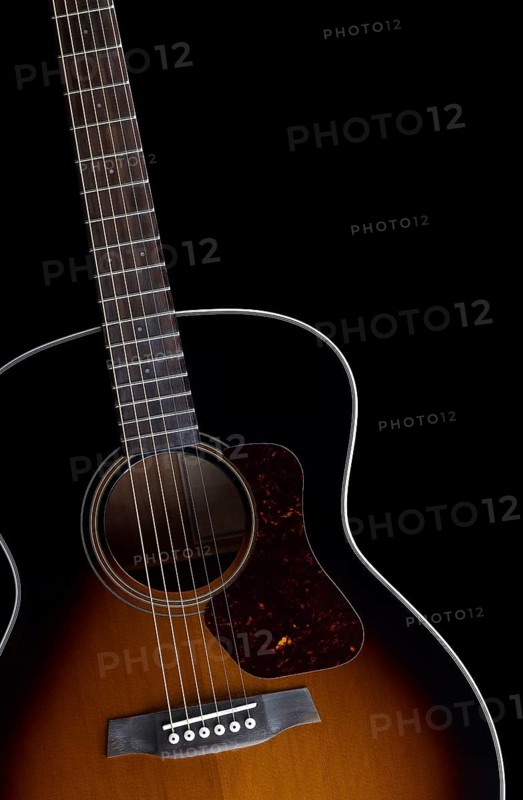 Detail of a acoustic guitar in black back