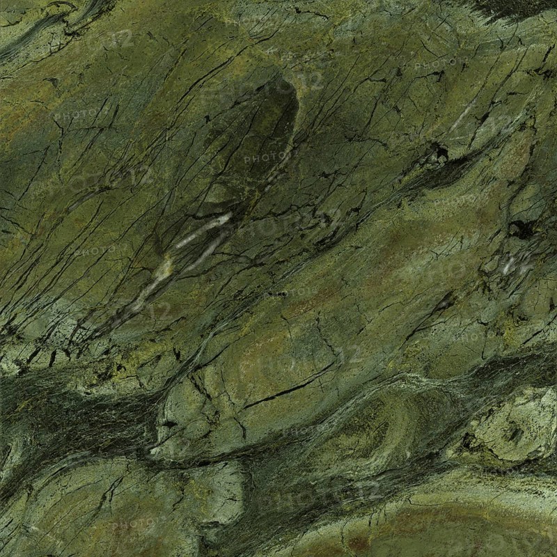 Full frame closeup shot showing a green marbled stone surface