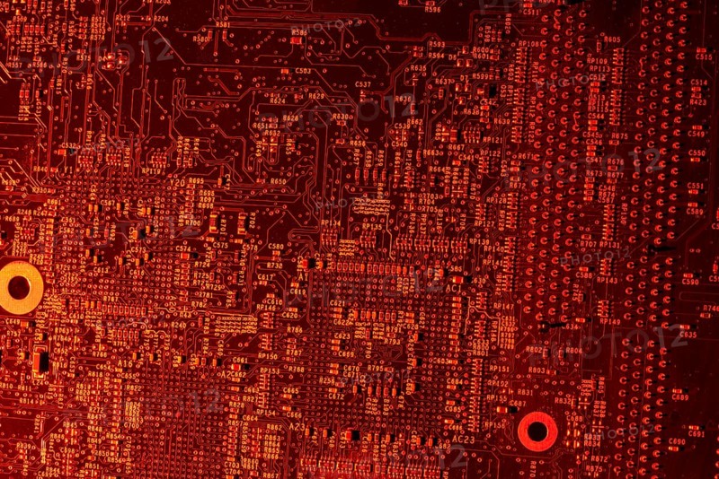Full frame red illuminated printed circuit board closeup