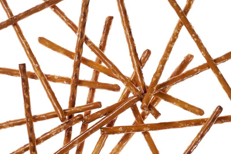 Closeup of some crossed salt sticks in white back