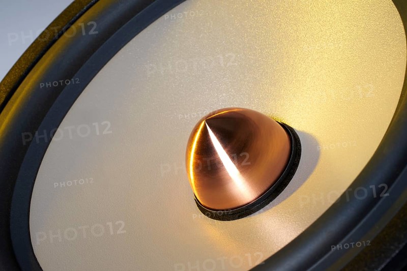 A yellow illuminated loudspeaker detail